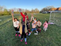 Focas team of kids with Gatorade water bottles on a soccer field