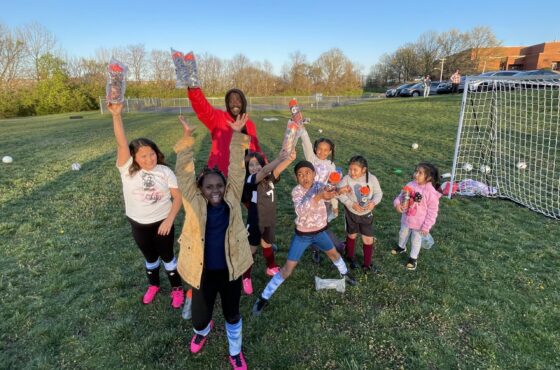 Focas team of kids with Gatorade water bottles on a soccer field