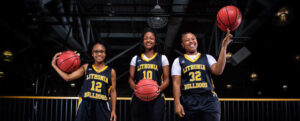 Three female basketball players