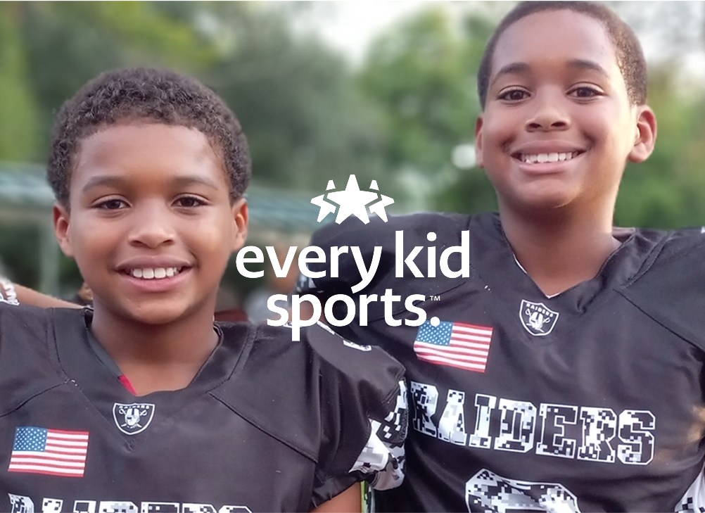 two young student athletes in football gear