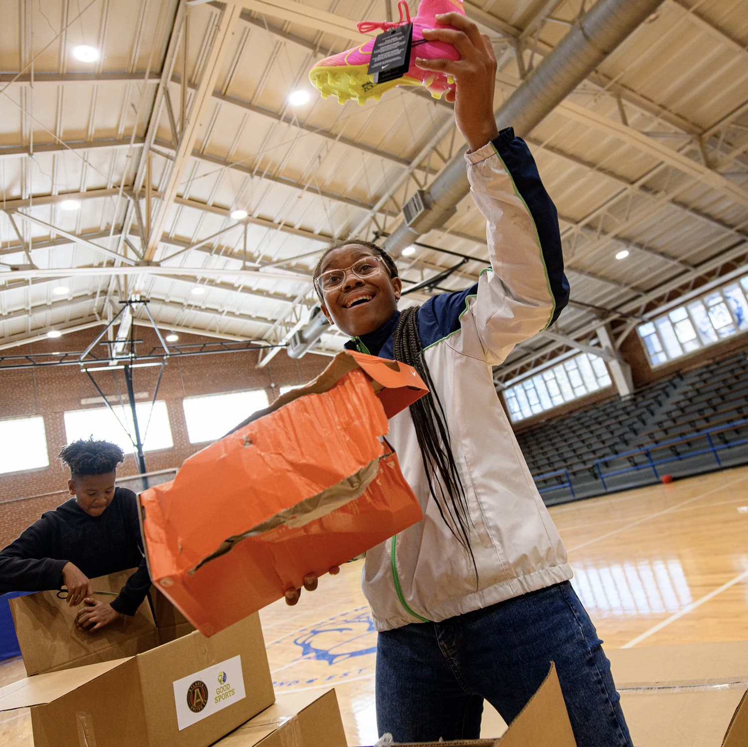 Girl unpacking sneakers